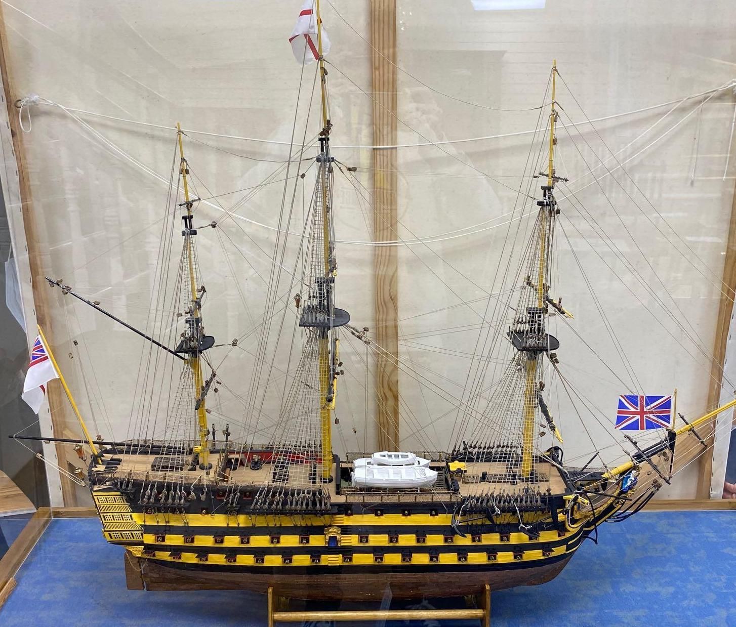 A model of the HMS Victory in perspex case, approximate length 120cm